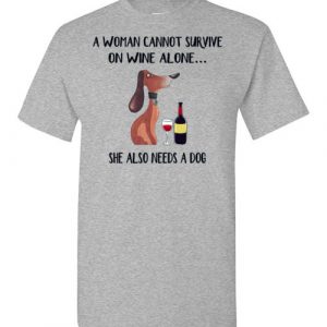 A WOMAN CANNOT SURVIVE ON WINE ALONE SHE ALSO NEEDS A DOG sports grey Gildan Short-Sleeve T-Shirt